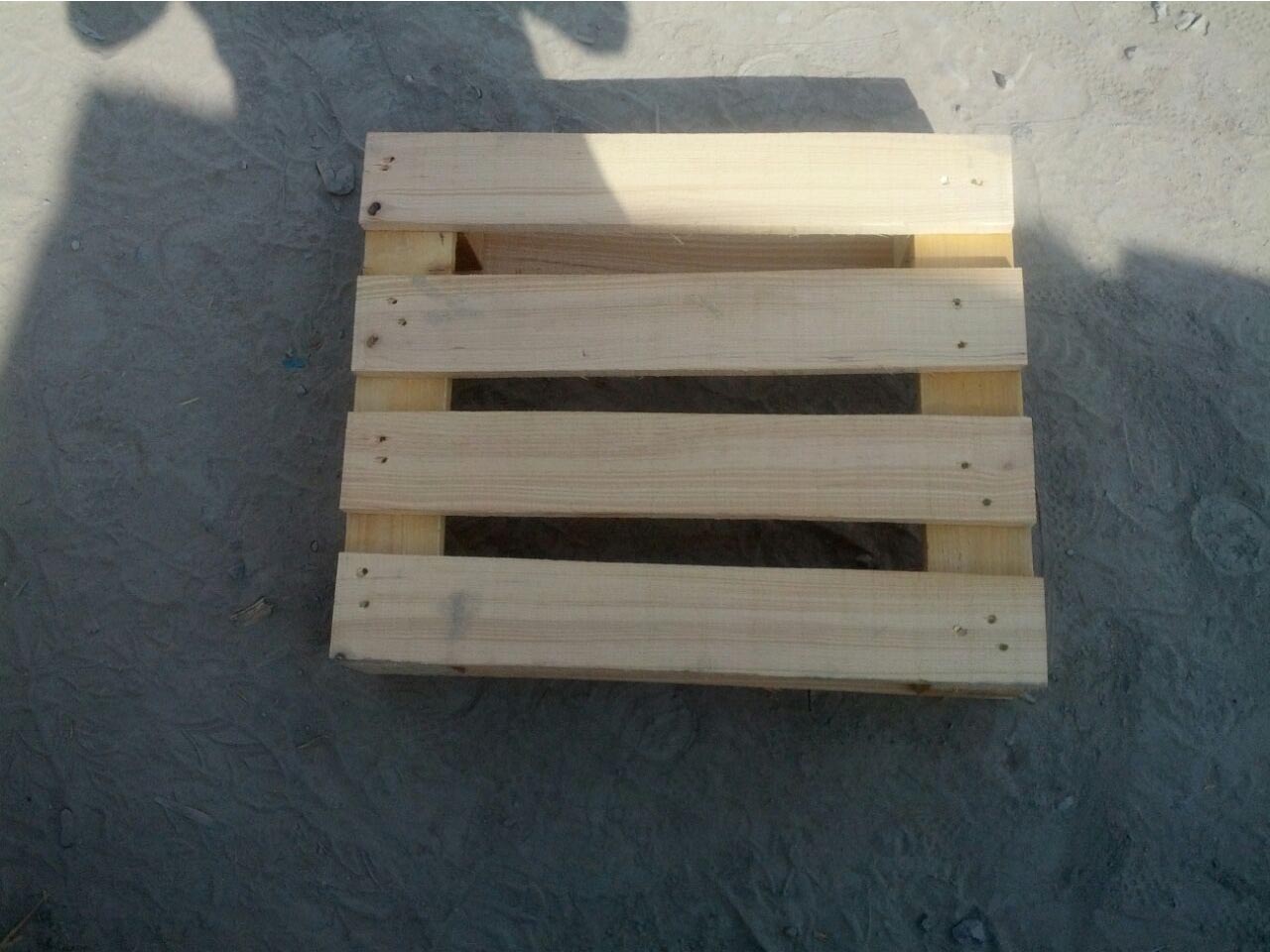 wooden pallet on the floor in shade